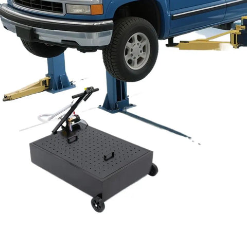 Heavy Duty 17 Gallon Oil Drain Pan With Manual Pump And 7.2 Foot Hose U Shaped Spout under a lifted truck for fluid collection.