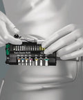 Person holding Tool Check Plus Imperial 39 Piece Bit And Socket Set with color coding, showcasing compact design and hex drive