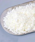 White Soy Wax Flakes For Candle Making 2 Pound Bulk 100 Percent Natural Soy Wax Premium Quality DIY Candles Clean Burn No Black Smoke Easy Melt Great For Beginners And Pros on a metal tray