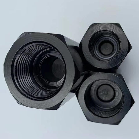 Close-up of a set of three black metal hydraulic valve fittings with 3/8 in NPT threads