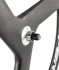 Close-up of 56Mm Carbon Road Bike Tri Spoke Wheelset with matte 3K finish for 700C clincher rim, Shimano hub compatible.