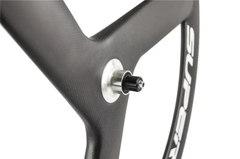 Close-up of 56Mm Carbon Road Bike Tri Spoke Wheelset with matte 3K finish for 700C clincher rim, Shimano hub compatible.