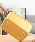 Heavy Duty Self Adhesive Furniture Casters With Stainless Steel Swivel Rollers And 360 Degree Glide Wheels under a yellow storage bin.
