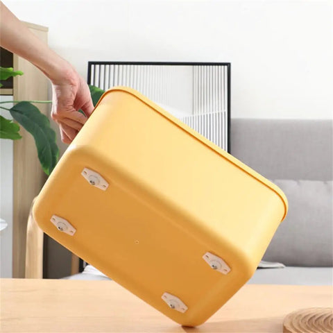 Heavy Duty Self Adhesive Furniture Casters With Stainless Steel Swivel Rollers And 360 Degree Glide Wheels under a yellow storage bin.