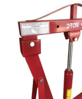 Detail of 2 Ton Folding Engine Hoist And Heavy Duty Engine Crane with warning label and lifting arm.