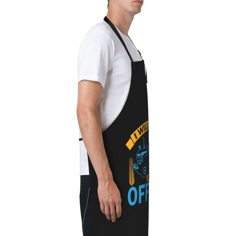 Side view of man wearing waterproof adjustable bib apron with pockets for men and women durable polyester keeps clothes clean