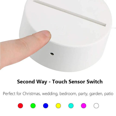 Finger touching a white 3D LED lamp base, highlighting the touch sensor switch feature, part of 20 Pack 3D Night LED Light Lamp Bases With Remote And USB Cable.