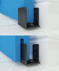 Matte Black Floor Guide For Wall Mount Sliding Barn Door Hardware Set Of 2, shown installed, fits non grooved doors from 1.375 to 1.75 inches thick.