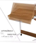 Height Adjustable Rolling Laptop Stand With Locking Wheels Folds Flat For Bed Or Couch showing lifting mechanism and wooden surface.
