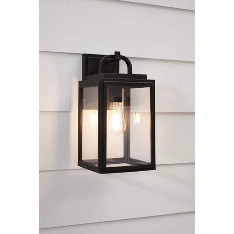 Grandbury Collection 1-Light Clear Glass Farmhouse Outdoor Wall Lantern in Textured Black mounted on white siding
