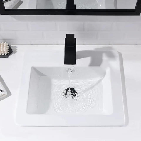 Drop In White Porcelain Vessel Sink With Black Faucet And Pop Up Drain, 21x18 Inch Bathroom Lavatory Basin, top view with water running