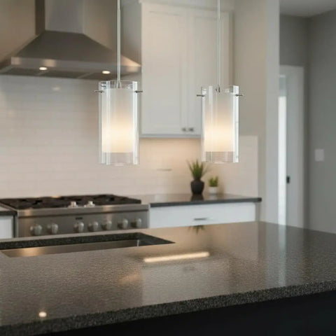 Dual Glass Pendant Lights 2 Pack with Brushed Nickel Finish hanging above a kitchen island with clear and frosted glass shades.