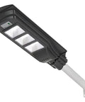 Badass Heavy Duty 350W Solar Floodlight With Photocensor And Motion Sensor Waterproof IP67 mounted on a white pole for outdoor lighting.