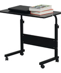 Slick Rolling Adjustable Height Computer Desk With Secure Locking Casters Heavy Duty Steel Frame And Scratch Resistant Top Mobile Standing Laptop Workstation For Tight Home Offices with laptop and books on top.