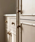 Close-up of kitchen cupboard with Vintage Walnut Wood Cabinet Handles Set With Zinc Alloy Drawer Pulls in Antique Metal Finish.