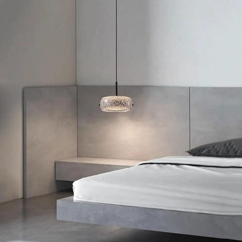 Resin Pendant Light, Gold 3 Color LED Hanging Fixture for Living Room above a modern bed in a stylish bedroom setting.