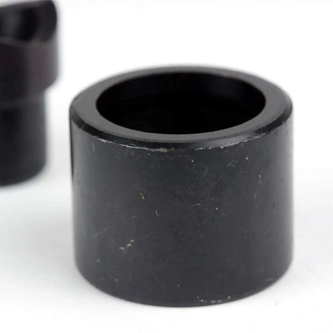 Close-up of One Half Inch Conduit Punch And Die For Hydraulic Knockout Driver Kit, black metal cylinder, punch for 0.86 inch holes.