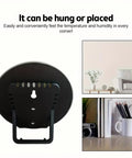 Portable Thermo Hygrometer With Handy Wide Temperature Range From Minus Thirty To Fifty Celsius And Humidity From Twenty To One Hundred Percent Easy Read Round Dial With Color Indicator Wall Mount Or Free Standing Indoor Outdoor No Electric rear view, black plastic, wall hang or stand