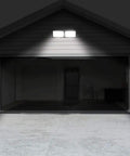 Dusk To Dawn LED Security Light With Built In Sensor 18W Plug In Flood Light installed on garage for outdoor lighting