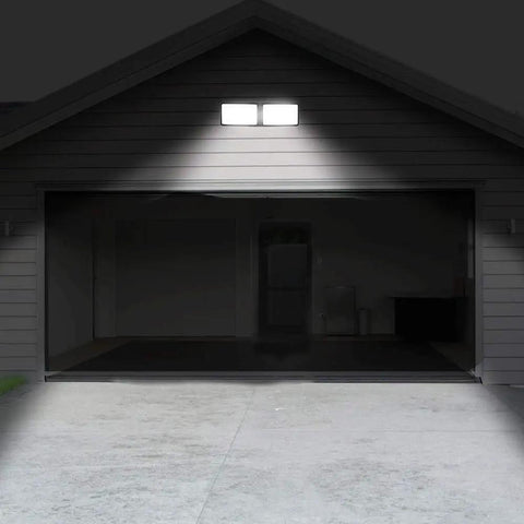Dusk To Dawn LED Security Light With Built In Sensor 18W Plug In Flood Light installed on garage for outdoor lighting