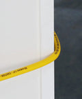 Yellow Air Compressor Hose Quarter Inch By Fifty Feet Hybrid Hose With Fittings And Quick Coupler Kit wrapped around a white surface