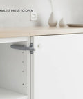 Push To Open Magnetic Cabinet Latch Handle Free Door Catch For Kitchen Cabinets And Wardrobes Durable PP Plastic Gray One Pack Sleek Flush Mount With Strong Magnetic Hold installed on cabinet