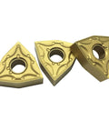 Gold-colored WNMG carbide turning inserts, set of three with central mounting holes for lathe tool holders