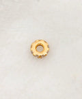 Totally Legit 14k Solid Yellow Gold Pave Diamond 4mm Wheel Spacer Bead on a soft surface, showcasing sparkling pave gems.