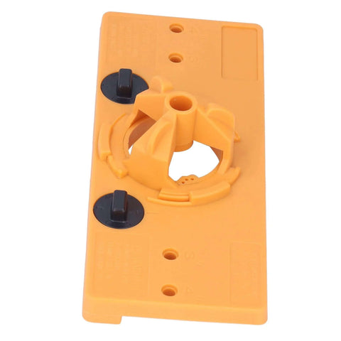 Front view of orange 35mm hinge-hole jig drill guide with black adjustment knobs for cabinet door drilling.