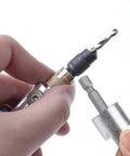 Person holding 20Pcs Quick Change Drill Bit Set With Swivel Head Driver And Flip Drive; showing close-up of drill bit and driver.