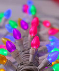 Easter String Lights LED Multi Color Glass C3 Bulbs 50 Count For Party Vibes On Patio And At Home, white wire, close-up view