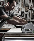 Killer 1200W Plunge Cut Circular Saw With Blazing 5200 RPM Speed being used by a carpenter for fine trim work in a workshop.