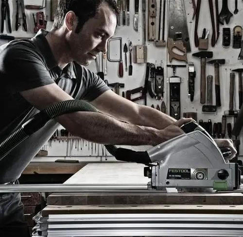 Killer 1200W Plunge Cut Circular Saw With Blazing 5200 RPM Speed being used by a carpenter for fine trim work in a workshop.