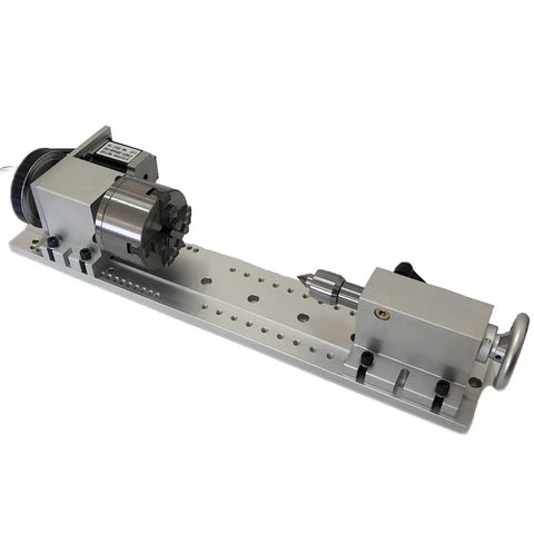 Built Tough 4 Axis CNC Rotary Tailstock With Heavy Duty Mounting Base And Nema 23 Stepper Motor For Slick Machining Projects Paired With A 100Mm Four Jaw Chuck on a silver metal base.