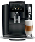 Recertified S8 Automatic Coffee And Espresso Maker In Slick Piano Black Featuring Color Touchscreen Aroma Grinder And Fine Foam Tech, with latte in glass.