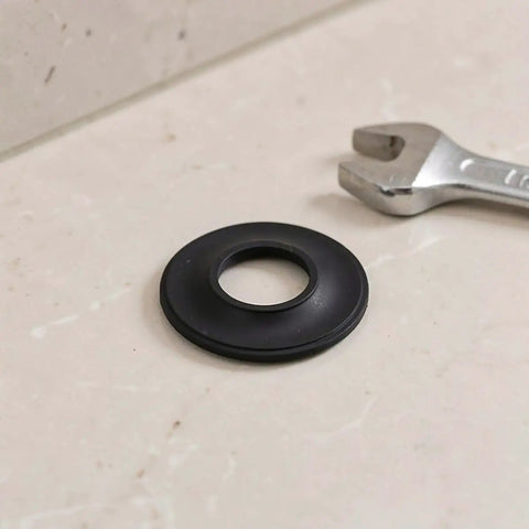 10pcs Rubber Bathtub Drain Washer for Pop up Stoppers and Drains, close-up of a rubber gasket on a counter with a wrench.