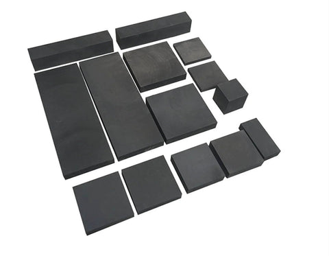 5 Piece 50x50mm Graphite Ingot Blocks, 99.9 Percent High Purity EDM Graphite Plates, arranged in varying sizes on a surface