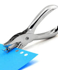 Compact Single Hole Punch Metal Circle Punch For Scrapbooking And Office Use 6mm Hole Puncher in use, punching through blue paper.