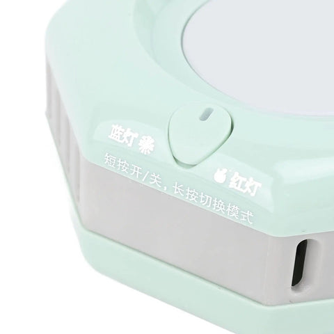 Close-up of the button on the Fast Cool Down Or Heat Electric Cooling Cup 420Ml showing control details and light indicators.