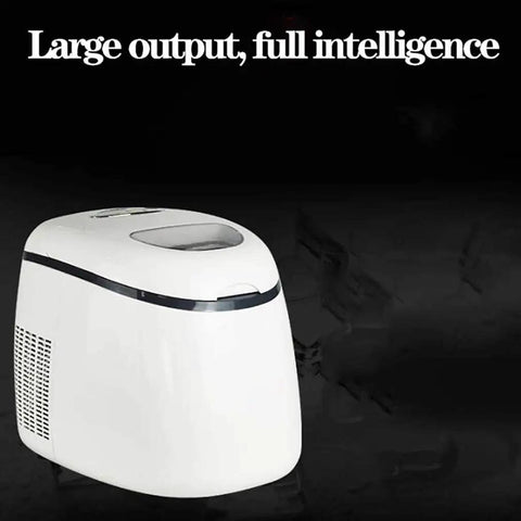 Compact Countertop Ice Maker Slaps Out Crisp Cubes In A Cinch, white unit showing top view and lid functionality.