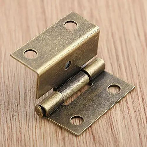 Close-up of a zinc alloy cabinet hinge from 4 Pack Zinc Alloy Cabinet Hinge Set For Cabinets, Jewelry Boxes, And Small Furniture 25x15x12mm With Screws Built To Last For Wood Boxes And Drawer Doors, shown on a wooden surface.