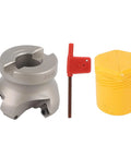Front view: silver face milling cutter head with 4 flutes, red adjustment tool, yellow cap.