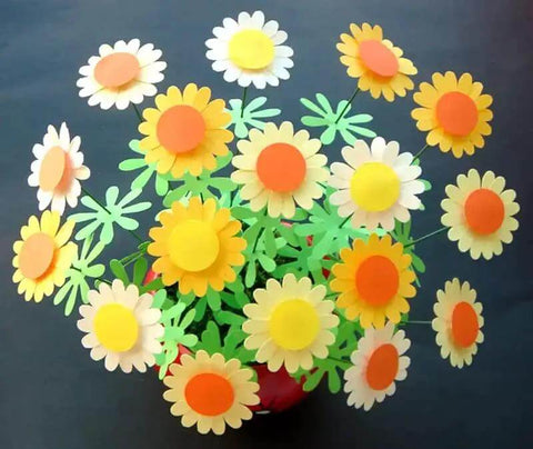 Colorful paper flowers made using the Circle Punch 1.2 Inch 30mm Craft Lever Punch for Scrapbooking and Card Making Gift Tags and DIY Paper Crafts.