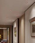 saditesdk 15 Pack Recessed Lighting Housing Trim Kits Rose Gold Led Ceiling Lamp Anti-Glare Led Downlights 5W 3000K/ 4000K/ 6000K Dimmable Led Recessed Downlights Indoor Decoration in a modern hallway.