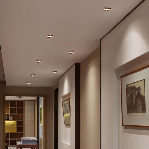 saditesdk 15 Pack Recessed Lighting Housing Trim Kits Rose Gold Led Ceiling Lamp Anti-Glare Led Downlights 5W 3000K/ 4000K/ 6000K Dimmable Led Recessed Downlights Indoor Decoration in a modern hallway.
