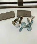 Pro Grade Clock Repair Tool Set With Plate Spreader And Pivot Tool Hardware displaying metal plates and screws