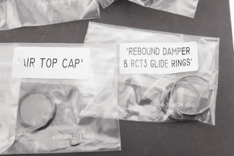 Fork Service Kit For SID And Reba 2013 To 2016 Solo Air A2 To A3 with rebound damper and glide rings in labeled bags