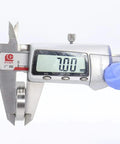 Digital caliper measuring 7mm thickness of Stainless Ceramic Hybrid Radial Bearing 18x30x7mm S18307 RS For Bicycle Hub Front And Rear