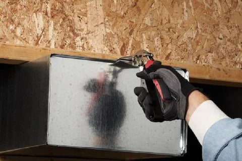 Malco S3R 3.25in offset REDLINE hand seamer being used on galvanized duct; gloved hand visible