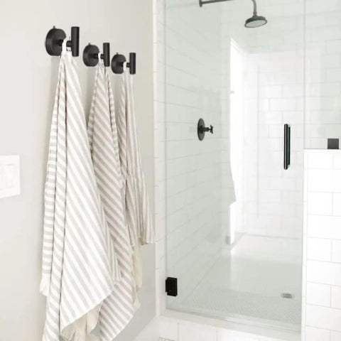 Large Suction Cup Shower Hooks Set Of 2 Black Stainless Steel Towel Hooks holding striped towels inside a shower